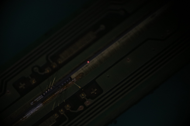 LED bar with two teeny-tiny LEDs on one of the dies lit